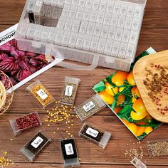 an assortment of seeds and seeding supplies on a wooden table with the words store various kinds of seeds