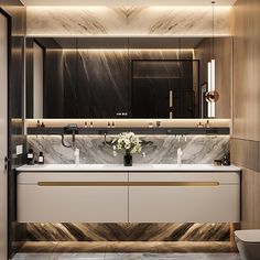 a modern bathroom with marble counter tops and gold trimming on the walls, along with two sinks