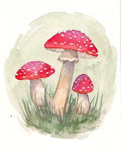 watercolor painting of three mushrooms in the grass with white dots on their caps and legs