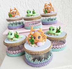 there are many cupcakes with sea creatures on them