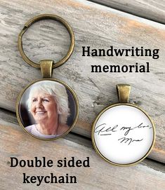 two personalized keychains with the words handwriting memorial and an elderly woman's face