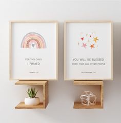 two wooden shelves with framed pictures on them, one has a plant and the other has a small house