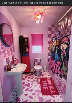 a bathroom decorated in pink and purple with lots of graffiti on the walls, rugs and sink