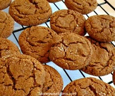 some cookies are cooling on a rack and ready to be baked in the oven for consumption