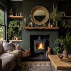 a living room filled with furniture and a fire burning in a fireplace next to a window