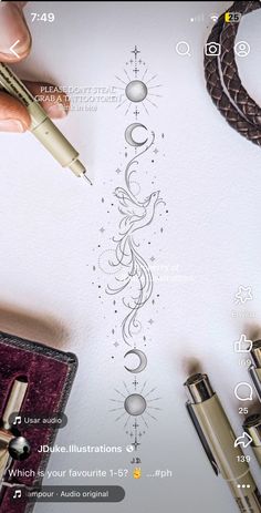 a person is drawing on paper with a pen and some other items around it,