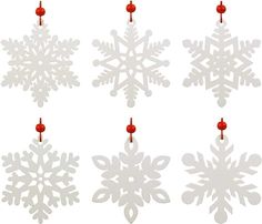 four snowflakes hanging from red string on white background