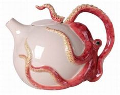 an octopus shaped tea pot is shown on a white background