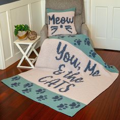 a crocheted afghan with the words you're mine written on it in blue and white