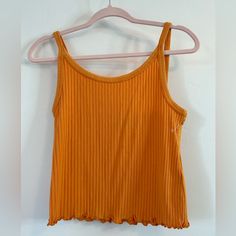 Super Cute, Oh So Soft Ribbed Cropped Cami/Tank Top With Spaghetti Straps. Size Medium. Color Is Called Wild Papaya, It Is Almost Pumpkin Orange, But A Bit Lighter. More Orange Than A Mustard Yellow. Would Make A Great Year Round Staple Piece, Or Pajama/Lounge Top! Brand New Condition, However The Tag Is Missing. Orange Ribbed Sleeveless Top, Yellow Camisole Crop Top For Spring, Summer Ribbed Tank Top With Spaghetti Straps, Summer Ribbed Spaghetti Straps Tank Top, Orange Sleeveless Casual Camisole, Yellow Fitted Casual Tank Top, Orange Casual Sleeveless Camisole, Casual Orange Sleeveless Camisole, Casual Fitted Yellow Tank Top