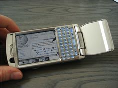 a person holding a cell phone in their left hand and showing the screen on it