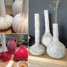 four different vases with flowers in them and one is made out of paper mache