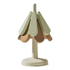 an umbrella shaped table lamp on a white base