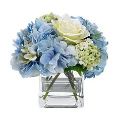 a vase filled with blue and white flowers