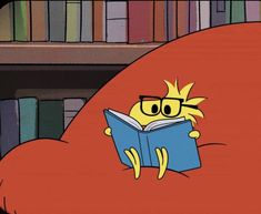 a cartoon character reading a book in front of bookshelves