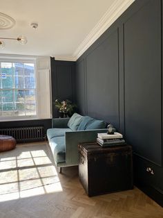 a living room filled with furniture and a window