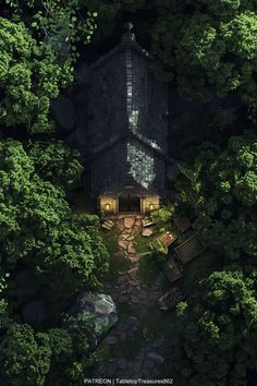 an aerial view of a house in the middle of some trees with lights on it