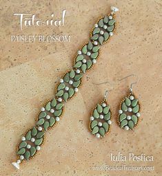 a pair of green and white beaded earrings on a tan background with text that reads tat - aid paisley blossom