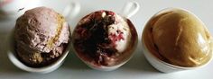 three different types of ice cream in white bowls