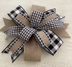 a black and white checkered bow with burlock on it's side