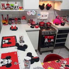 a kitchen with mickey mouse coasters on the counter