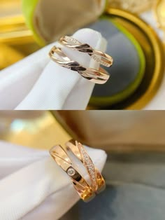 two different types of wedding rings sitting on top of each other