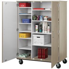 an open storage cabinet with many items on the shelves and two doors, one door closed