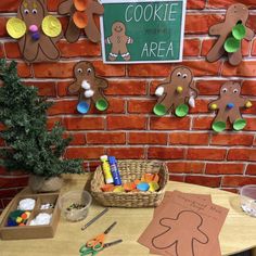 gingerbread cookies are on the wall next to some crafting supplies