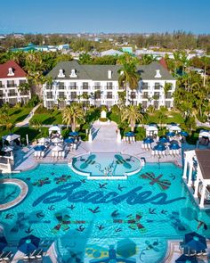 an aerial view of the pool and surrounding buildings