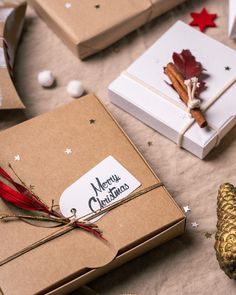 christmas presents are wrapped in brown paper and tied with twine, on a table