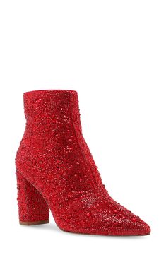 Instantly elevate any outfit with these fabulous pointy toe booties covered in a symphony of glittering crystals. 3 1/5" heel 5 1/5" shaft height Side zip closure Rhinestone and textile upper/textile lining/synthetic sole Imported Red Ankle Boots, Blue By Betsey Johnson, Dress Booties, Betsey Johnson Shoes, Betsy Johnson, Glitz And Glam, Red Rhinestone, Shoes Booties, Heeled Ankle Boots