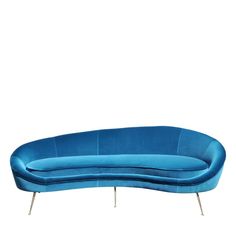 a blue couch sitting on top of a white floor