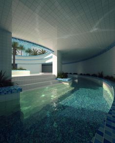 an indoor swimming pool in the middle of a building