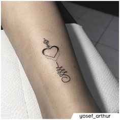 a woman's arm with a tattoo on it that says love and a diamond