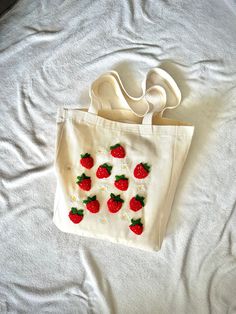 Introducing our chic Strawberry Design Tote, a delightful addition to your accessory collection! Handmade with care, this adorable Strawberry Tote is as cute as it is practical. Crafted from sturdy canvas, this shoulder bag is perfect for everyday use, whether you're running errands or heading to the farmer's market. Stand out with this sweet and stylish tote by your side! Canvas tote dimensions , 35x40x10 cm ( 13.7"x 16"x 3.9") handle lenght 70cm (27.5") Not suitable for washing. You can clean it by wiping it with a wet cloth. For different models, please don't forget to visit my store linked below;  https://www.etsy.com/shop/SakuraPunchDesign       If you have any questions please feel free to message me, i would be happy to help you! Enjoy your shopping! Canvas Bag, Running Errands, Canvas Tote, Shoulder Bag, Bathing Beauties, Accessory Gift, Electronic Accessories, Purses And Bags, Etsy Uk