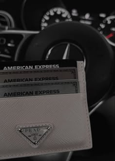 the interior of a car with an american express card holder