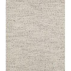 a white rug with small black dots on the top and bottom, it is very soft