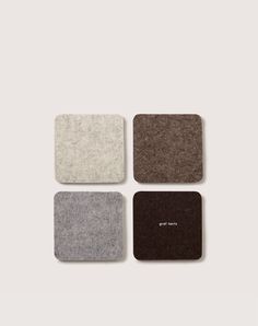 four square coasters in various colors and sizes