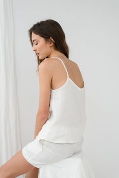 "When ordering you can choose to have the \"SHORTS\" or \"TOP\" only or the whole \"PAJAMA SET\" of both items. When buying a set you save 5 euro. Milky white ELLA shorts with two side pockets and relaxed fit TILDA cami top. TOP: - length is ± 59 cm (23.2\") (depends on size) - spaghetti strap - bust darts - v neckline BOTTOM: - outseam ± 38 cm (14.9\") (depends on size) - inseam is ± 10 cm (3.9\") - elastic waistband with fabric strap - two side pockets DETAILS: - 100 % European, pre-washed med Summer V-neck Camisole For Lounging, Summer Sleep Camisole Sets, Sleeveless Relaxed Fit Summer Sleepwear, Summer Sleepwear Cami Set, Sleeveless Summer Lounging Sets, Short Linen Top For Vacation, Short Linen Vacation Top, Short Camisole For Summer Loungewear, Short Summer Camisole For Loungewear