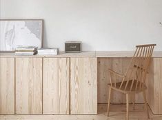 a wooden chair sitting in front of a desk