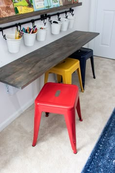 two stools and a table in a room