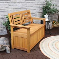 a wooden bench sitting on top of a patio next to a turtle