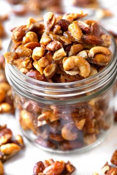 a jar filled with nuts sitting on top of a table