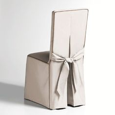 a white chair with a bow on the back