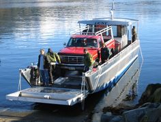 people are boarding a boat in the water