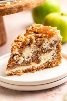 a piece of cake sitting on top of a white plate next to an apple pie