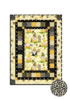 a yellow and black quilt with an image of bees on the ground next to it