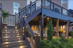 a house with stairs and lights on the side