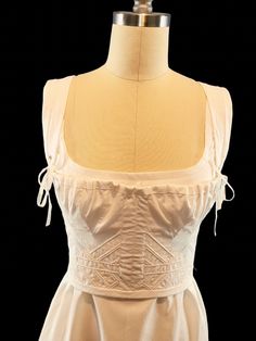 Beautifully and delicate looking short stay, corded with sturdy cotton cord. The front of this corset has 2 flat steel bones that rest between the gored bust panels. The bust is adjustable with a gathering cord. The straps are adjustable. Made with 100% cotton. This stay/corset gives the perfect support and silhouette for Regency gowns, as well as my Italian Renaissance style gowns. Time to make is set at 4-6 weeks, however if you need something sooner please feel free to message me. I can usual Cotton Overbust Corset Dress, White Corset With Adjustable Straps And Fitted Bodice, Corset Dress With Adjustable Straps And Fitted Bodice, Cotton Square Neck Corset With Corset Back, Fitted Cotton Corset With Adjustable Straps, Cotton Fitted Corset With Adjustable Straps, Sleeveless Cotton Corset With Fitted Bodice, Cotton Corset With Adjustable Straps, Cotton Sleeveless Corset With Fitted Bodice