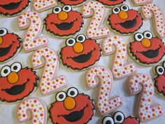 decorated cookies are arranged in the shape of numbers for elmo's 2nd birthday